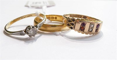 Lot 56 - A 22ct gold band ring, a diamond solitaire ring and a 15ct gold stone-set ring