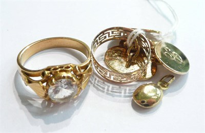 Lot 65 - A pair of 9ct gold cuff-links, a pierced band ring stamped '585' and a white stone-set ring