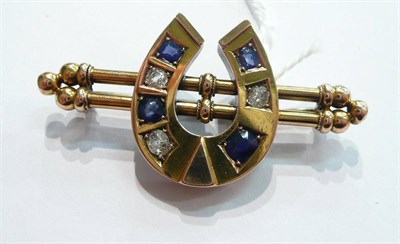 Lot 68 - A sapphire and diamond horseshoe bar brooch