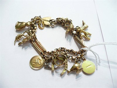 Lot 74 - A charm bracelet hung with thirteen charms