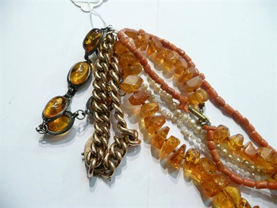 Lot 92 - A curb and link bracelet, a 9ct gold band ring, a silver amber bracelet, a coral necklet, etc