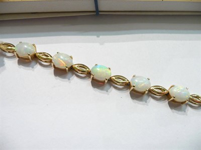 Lot 93 - An opal bracelet stamped '18K'