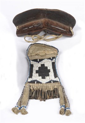 Lot 1216 - A North American Indian Beadwork and Caribou Skin Pouch, 19th century, of concave sided rectangular