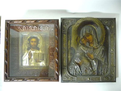 Lot 1224 - A Russian Icon, Virgin and Child, late 19th century, the embossed and pierced oklad parcel...