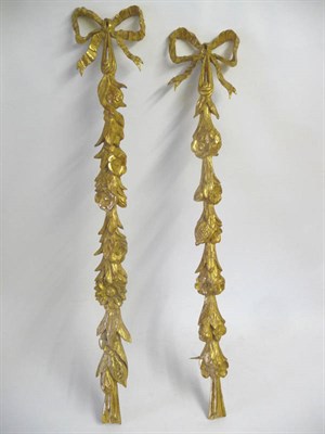 Lot 1230 - A Pair of Carved Wood, Gilt and Gesso Ribbon Tied Cascading Fruit Wall Appliques, probably 18th...