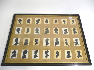 Lot 1255 - A Group of Twenty-Eight Silhouettes, 19th century, mounted in one frame, including ladies,...