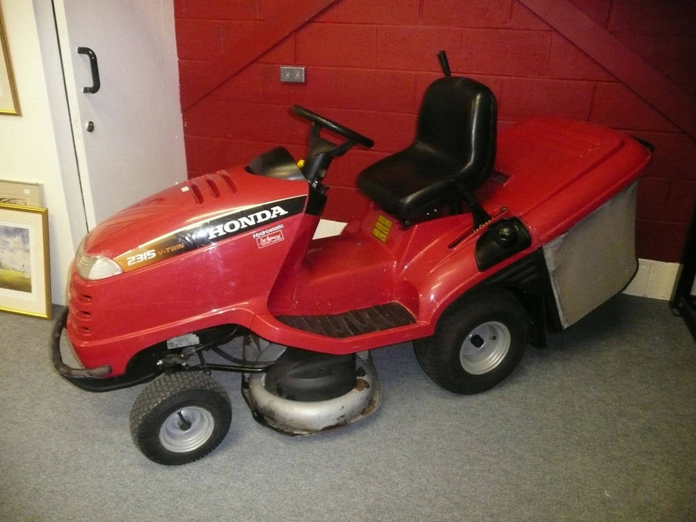 Lot 716 - A Honda HF2315 HME lawn tractor powered by a 15hp Honda engine with two keys and manuals