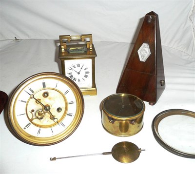 Lot 11 - A carriage timepiece, travelling clock (a.f.), clock dial and movement and a metronome