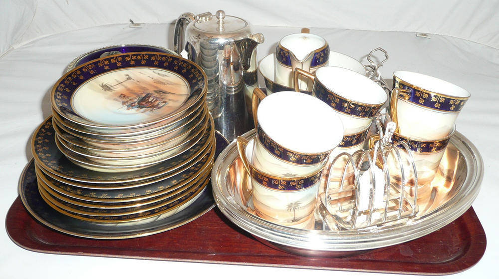 Lot 14 - A Czechoslovakian part tea set, three plated dishes, a silver pill box etc
