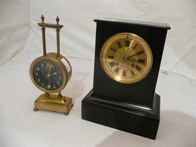 Lot 23 - A black slate striking mantel clock and a small gravity clock