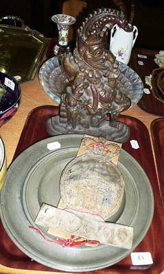 Lot 43 - Mr Punch cast iron doorstop, three large pewter plates and another smaller and a lead fire mark.