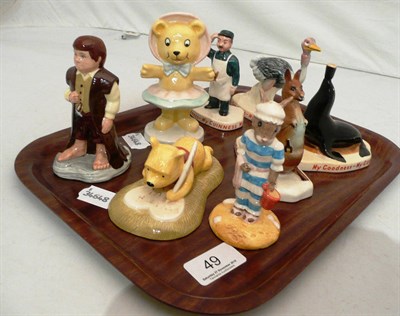 Lot 49 - Four Carltonware Guinness figures and four Royal Doulton figures including Bilbo, Tessie Bear,...