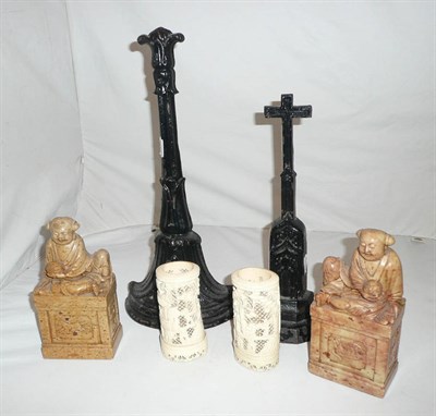 Lot 56 - Two cast iron doorstops, two carved soapstone figures and two carved ivory beakers
