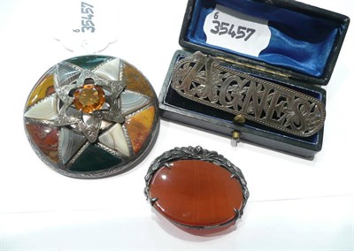 Lot 80 - A Scottish hardstone brooch, a cornelian brooch and an 'Agnes' brooch