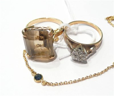 Lot 93 - A sapphire set bracelet, a diamond cluster ring and a smokey quartz ring