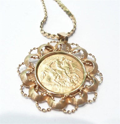 Lot 94 - A 1911 half sovereign in pendant mount on a fancy link chain