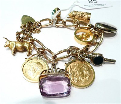 Lot 95 - A 9ct gold charm bracelet, 70.4g with a full sovereign and half sovereign
