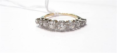 Lot 102 - A diamond half hoop ring