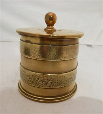 Lot 115 - A brass tobacco box made from a shell case