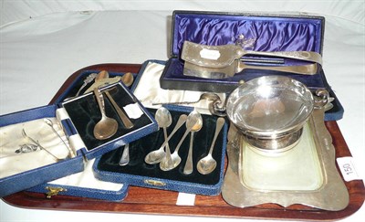 Lot 150 - Tray including cased silver teaspoons, plated asparagus tongs, two silver pin dishes, silver...