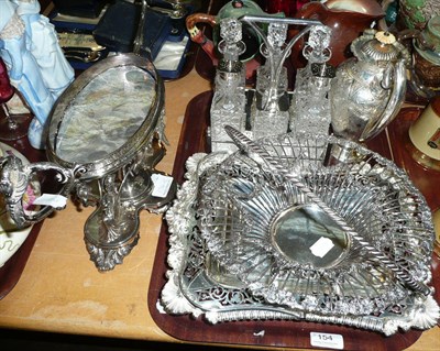 Lot 154 - Plated centrepiece (lacking bowl), six bottle cruet set, pierced basket, hot water jug and a plated