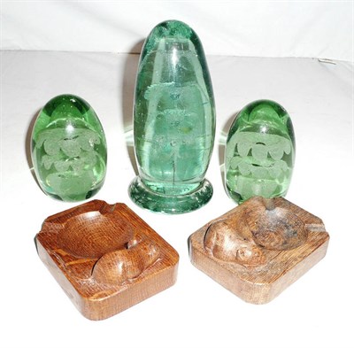 Lot 164 - Two 'Mouseman' ashtrays and three green glass dumps