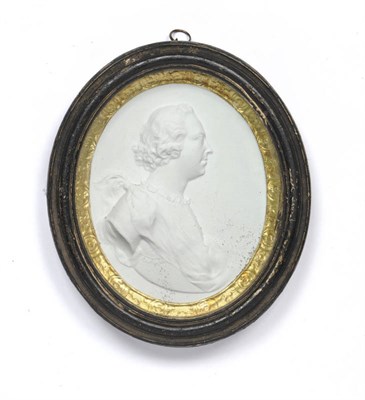 Lot 1294 - A Relief Cast Plaster Profile Portrait of a Gentleman, circa 1775, oval, the sitter facing to...