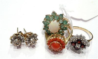 Lot 182 - A 9ct gold coral cluster ring, a 9ct gold garnet and cz cluster ring, 9ct gold opal and emerald...