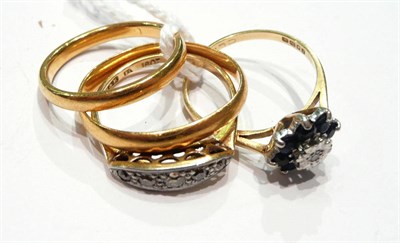 Lot 183 - Two 22ct gold band rings, five stone diamond ring and a diamond and sapphire flower head ring