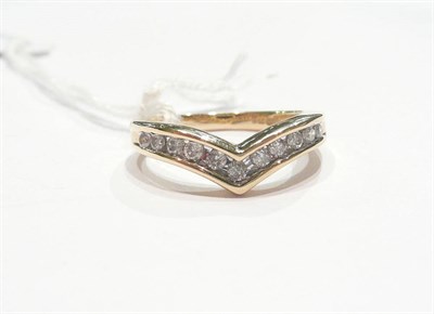 Lot 190 - Lady's diamond wishbone ring