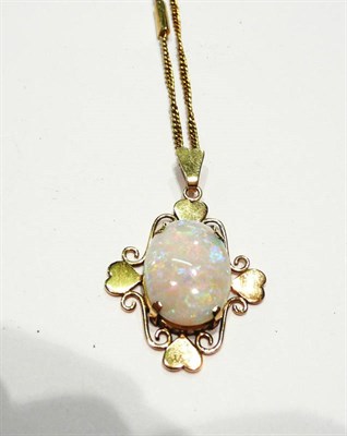 Lot 193 - An oval cabochon opal pendant on chain