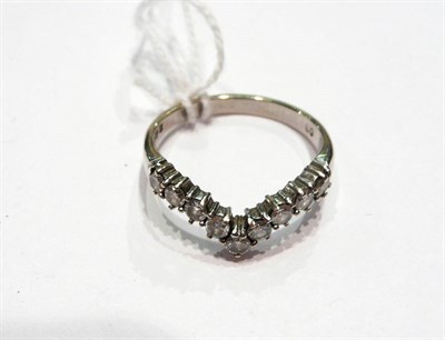 Lot 240 - An 18ct white gold diamond wish bone ring