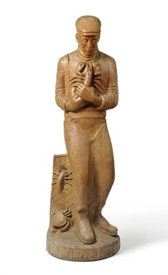 Lot 1301 - A One Piece Tree Section Carved Figure of a Cornish Fisherman, circa 1930, standing gazing...