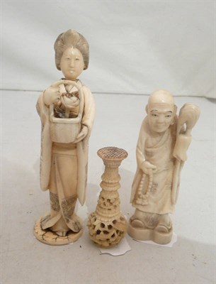 Lot 243 - Two carved ivory figures and a carved ivory seal (3)