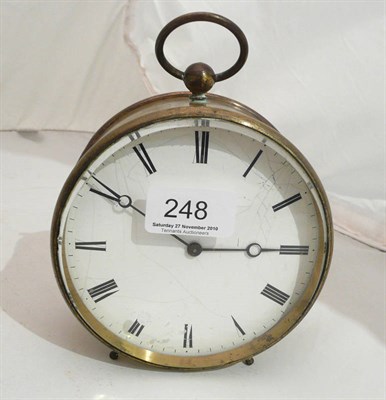 Lot 248 - A brass clock with enamelled dial and key