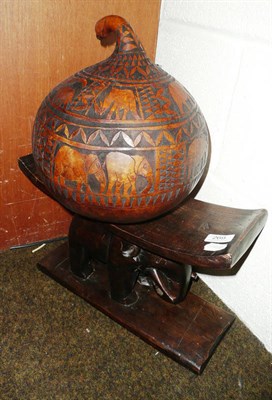 Lot 269 - African elephant stool and a gourd