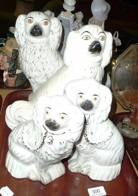 Lot 300 - Four Victorian Staffordshire spaniel dogs