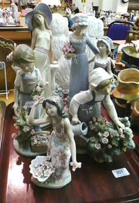 Lot 301 - Five assorted Lladro figural groups with flowers