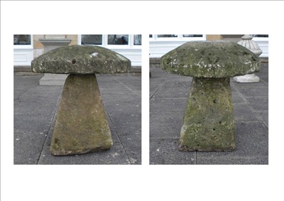 Lot 1307 - A Pair of Large Staddle Stones, in cream coloured stone, the domed tops on angled square...