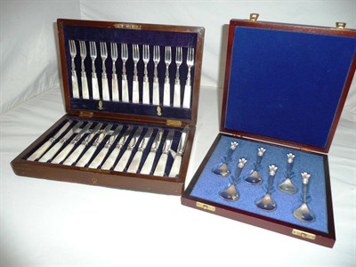 Lot 307 - Cased set of modern silver spoons and mahogany case of silver and mother of pearl fruit eaters (2)