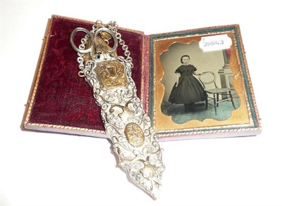 Lot 326 - A pair of silver handled scissors in an elaborate brass case and a cased ambrotype portrait (2)