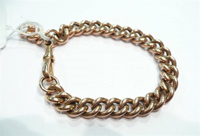 Lot 338 - A rose gold curb bracelet with spare links, stamped every link