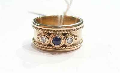 Lot 347 - Diamond and sapphire three stone ring