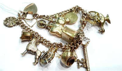 Lot 348 - 9ct gold charm bracelet hung with sixteen charms