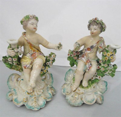 Lot 379 - Pair of 19th century English flower-encrusted figures