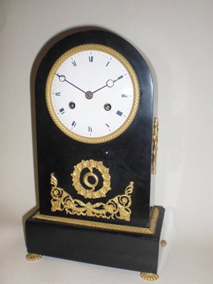 Lot 1316 - A French Black Slate and Gilt Mounted Striking Mantel Clock, circa 1830, the small arched case with