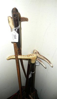 Lot 394 - Six leather riding crops including two with silver mounts and an 18ct gold-mounted example