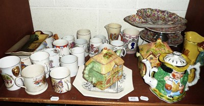 Lot 403 - Shelf of assorted commemorative pottery, chintz printed pottery and other decorative items