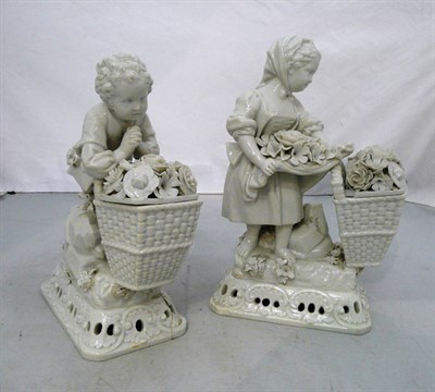 Lot 421 - Pair of Meissen white glazed figures with baskets