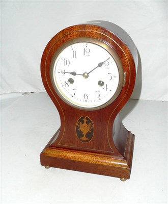 Lot 422 - A balloon-shaped striking inlaid mantel clock